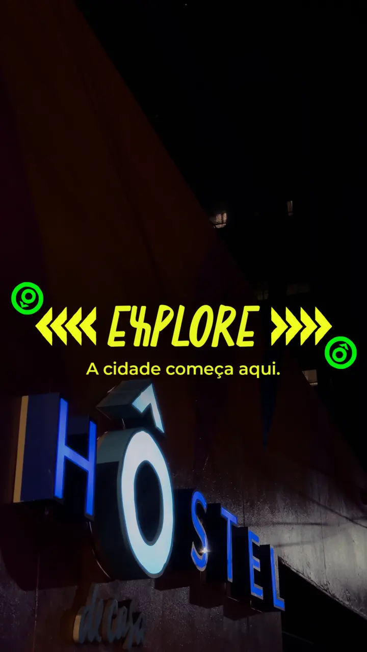 Highlight cover reading EXPLORE over the lit hostel sign at night.